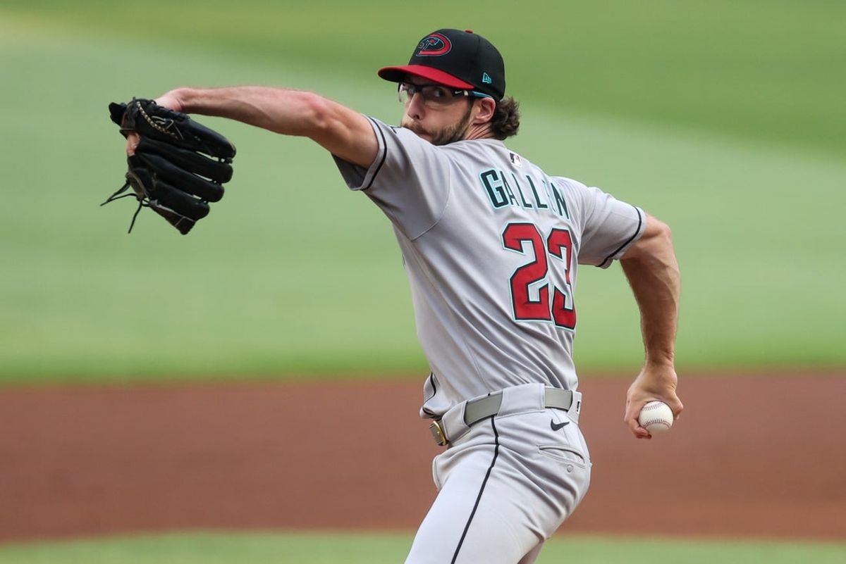 Jun 3, 2025; Atlanta, Georgia, USA; Arizona Diamondbacks starting pitcher Zac Gallen (23) throws against the Atlanta Braves in the first inning at Truist Park. Mandatory Credit: Brett Davis-Imagn Images