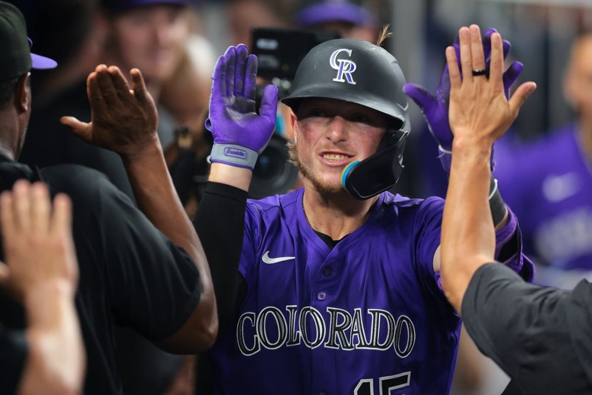Jun 3, 2025; Miami, Florida, USA; Colorado Rockies catcher Hunter Goodman (15) celebrates with teammates after hitting a solo home run against the Miami Marlins during the eighth inning at loanDepot Park. Mandatory Credit: Sam Navarro-Imagn Images