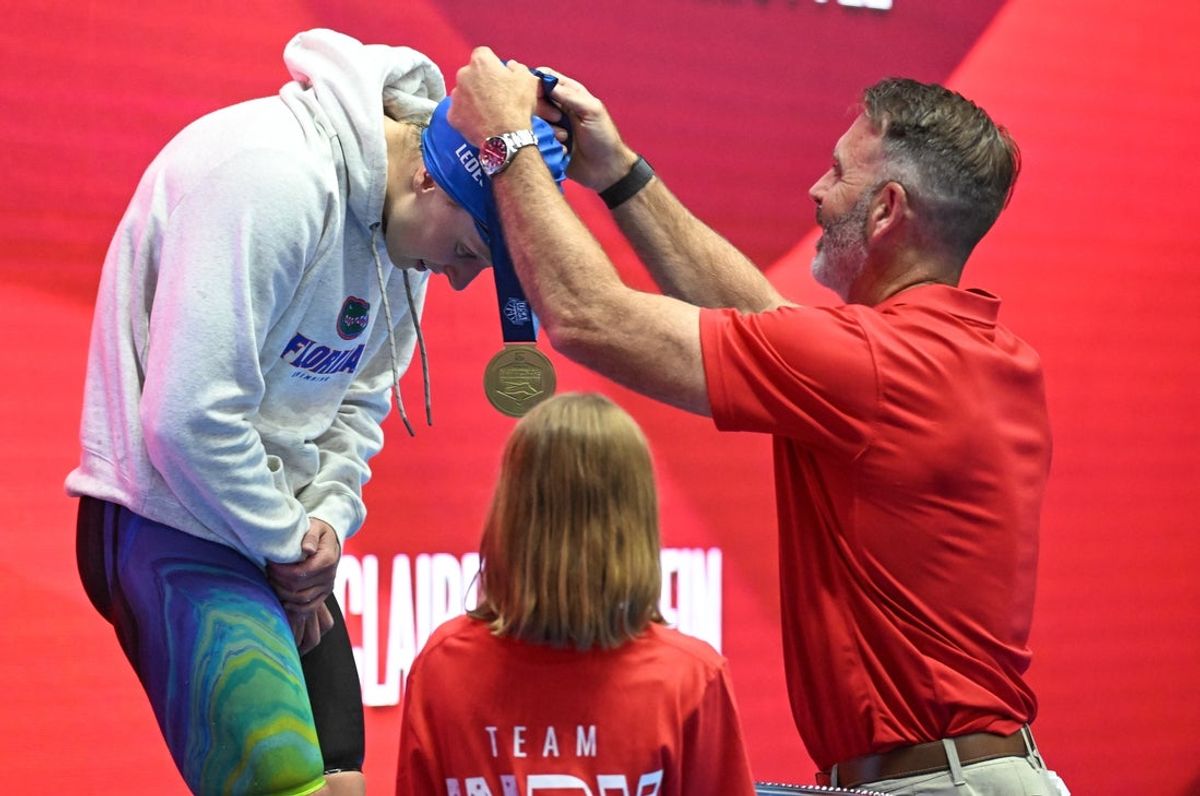 Jun 3, 2025; Indianapolis, Indiana, UNITED STATES; Katie Ledecky receives her medal after winning the women's 800 meter freestyle at the Toyota National Championships swimming meet at Indiana University Natatorium. Mandatory Credit: Robert Goddin-Imagn Images