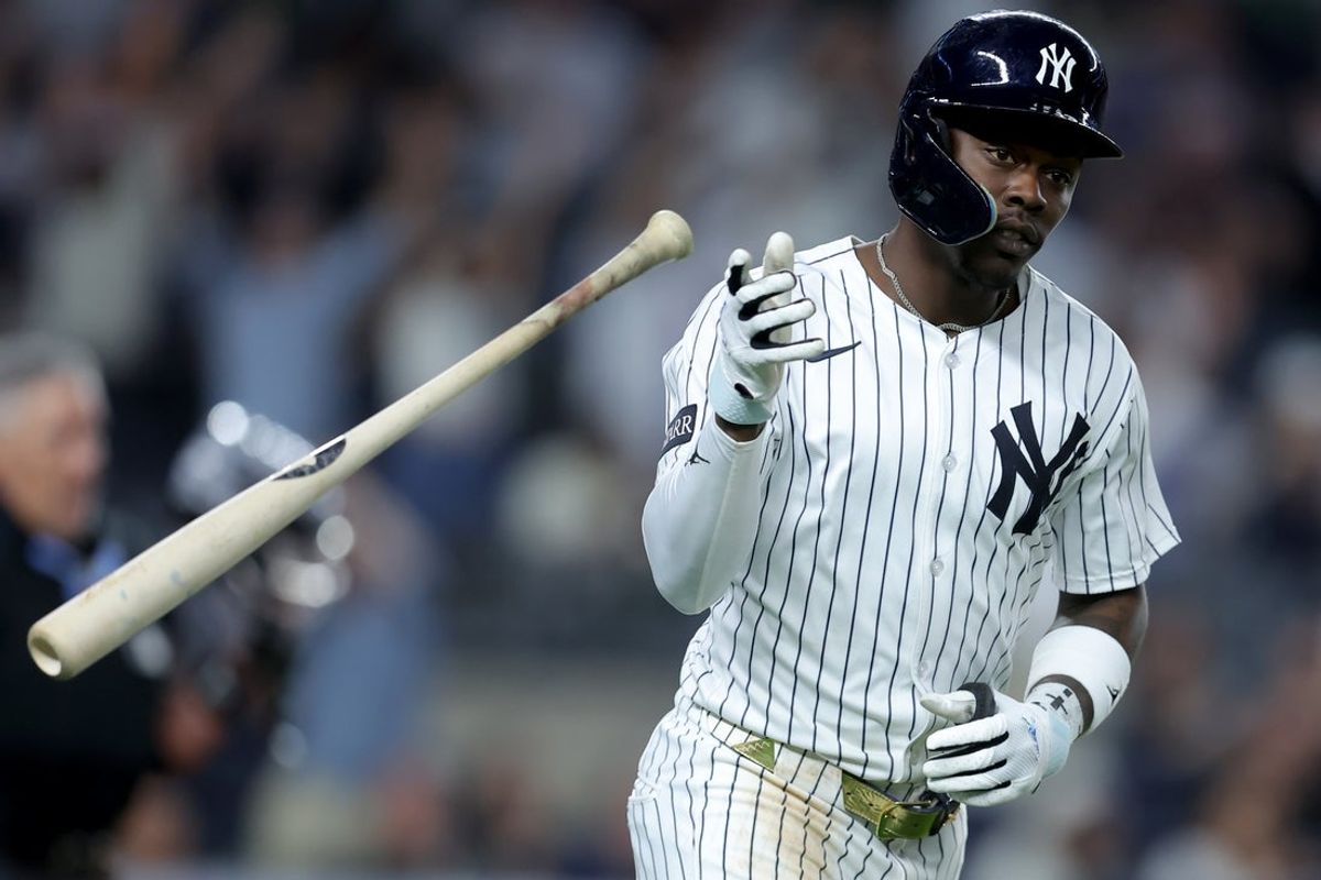 Jun 3, 2025; Bronx, New York, USA; New York Yankees third baseman Jazz Chisholm Jr. (13) flips his bat after hitting a solo home run against the Cleveland Guardians during the seventh inning at Yankee Stadium. Mandatory Credit: Brad Penner-Imagn Images