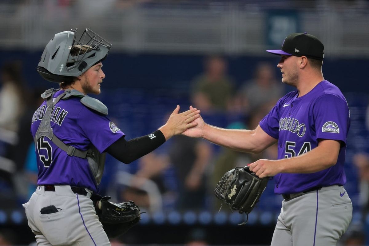 Jun 3, 2025; Miami, Florida, USA; Colorado Rockies relief pitcher Seth Halvorsen (54) celebrates with catcher Hunter Goodman (15) after the game against the Miami Marlins at loanDepot Park. Mandatory Credit: Sam Navarro-Imagn Images