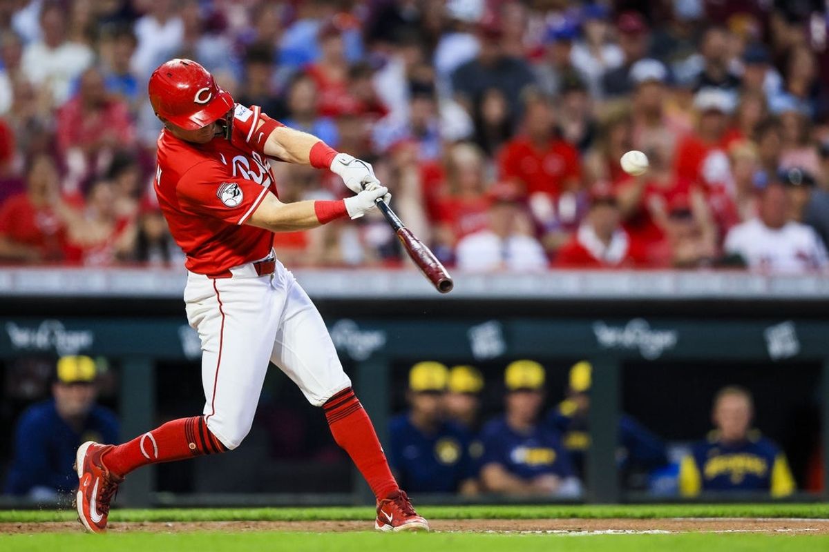Jun 3, 2025; Cincinnati, Ohio, USA; Cincinnati Reds second baseman Matt McLain (9) hits a double in the seventh inning against the Milwaukee Brewers at Great American Ball Park. Mandatory Credit: Katie Stratman-Imagn Images