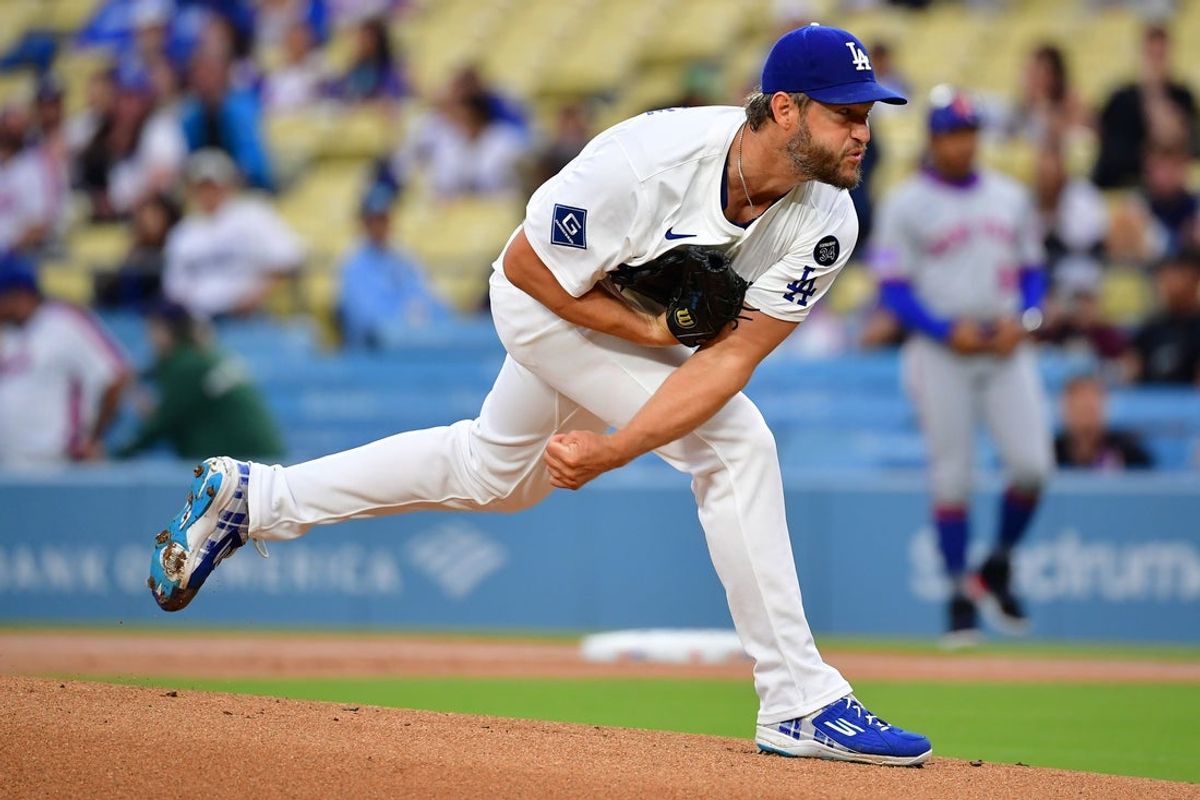 Jun 3, 2025; Los Angeles, California, USA; Los Angeles Dodgers pitcher Clayton Kershaw (22) throws a pitch against the New York Mets during the first inning at Dodger Stadium. Mandatory Credit: Gary A. Vasquez-Imagn Images