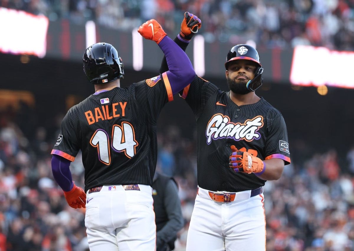Jun 3, 2025; San Francisco, California, USA; San Francisco Giants left fielder Heliot Ramos (17) celebrates with catcher Patrick Bailey (14) after batting him in on a two-run home run against the San Diego Padres during the third inning at Oracle Park. Mandatory Credit: Kelley L Cox-Imagn Images