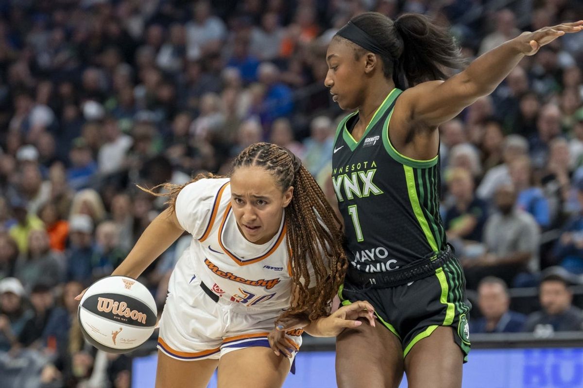 Jun 3, 2025; Minneapolis, Minnesota, USA; Phoenix Mercury guard Haley Jones (30) dribbles the ball past Minnesota Lynx forward Diamond Miller (1) in the second half at Target Center. Mandatory Credit: Jesse Johnson-Imagn Images