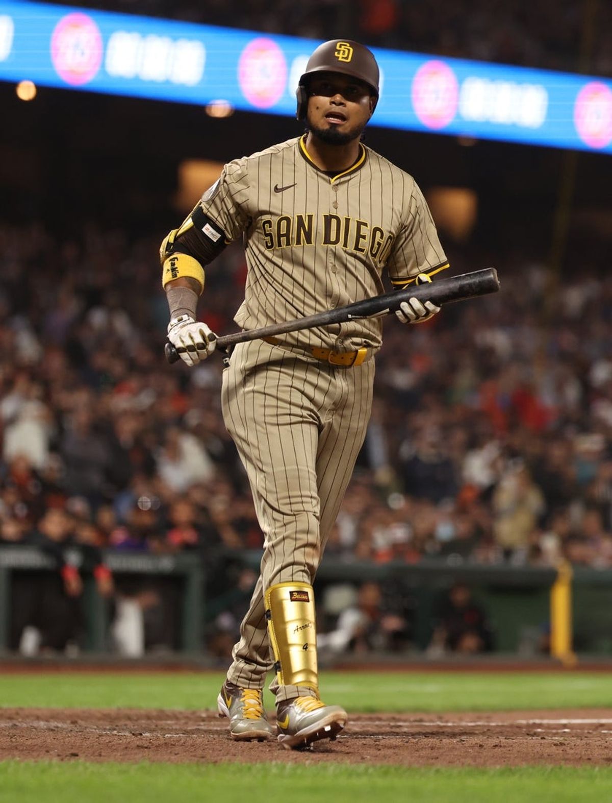 Jun 3, 2025; San Francisco, California, USA; San Diego Padres first baseman Luis Arraez (4) reacts after earning a walk against the San Francisco Giants during the ninth inning at Oracle Park. Mandatory Credit: Kelley L Cox-Imagn Images