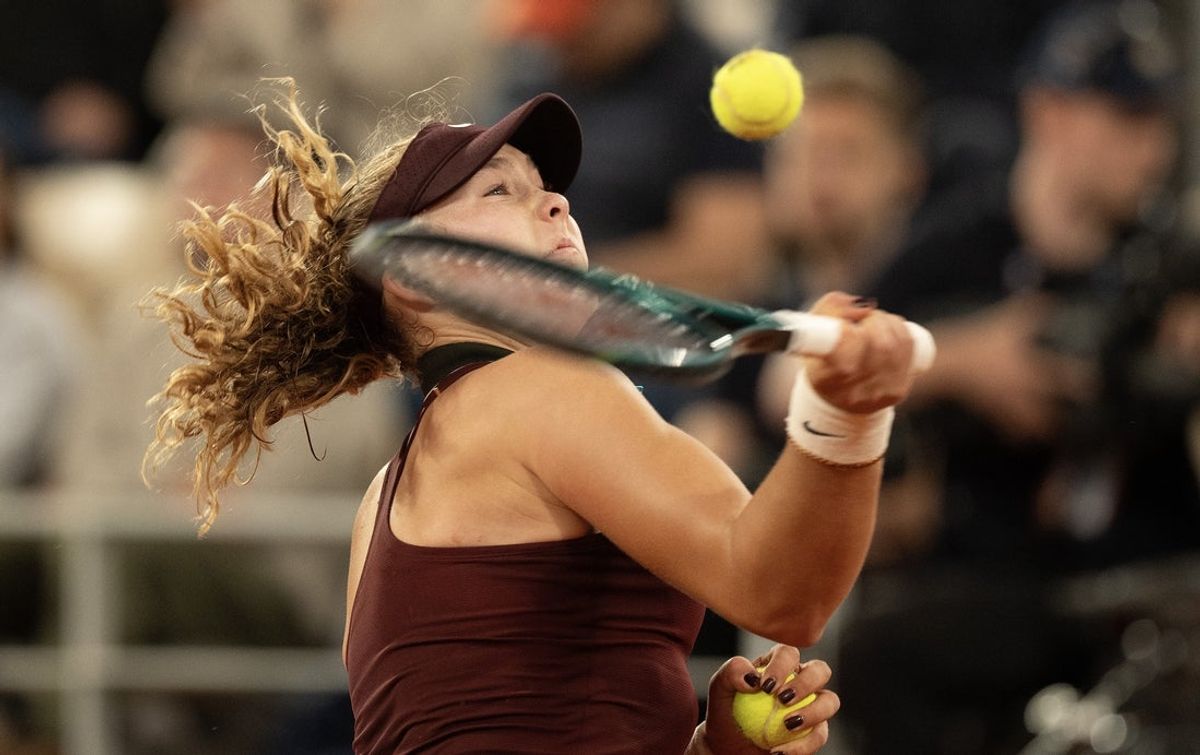 Jun 4, 2025; Paris, FR; Mirra Andreeva reacts by hitting a ball into the stands during her match against Lois Boisson of France on Day 11 at Roland Garros Stadium.  Mandatory Credit: Susan Mullane-Imagn Images