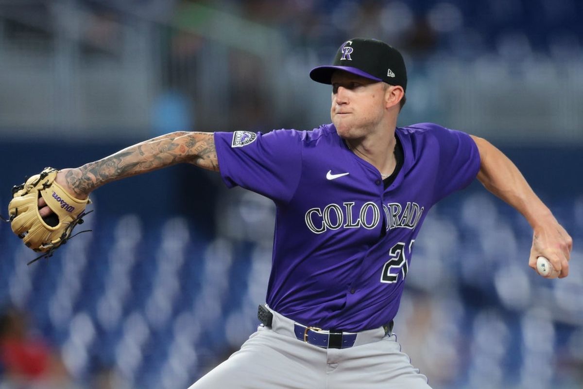 Jun 4, 2025; Miami, Florida, USA; Colorado Rockies starting pitcher Kyle Freeland (21) delivers a pitch against the Miami Marlins during the first inning at loanDepot Park. Mandatory Credit: Sam Navarro-Imagn Images