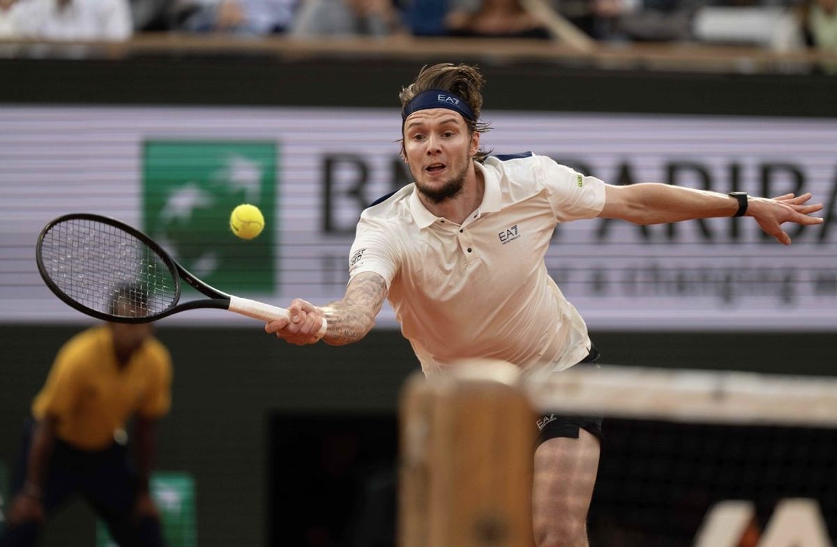 Jun 4, 2025; Paris, FR; Alexander Bublik of Kazakhstan returns a shot during his match against Jannik Sinner of Italy on day 11 at Roland Garros Stadium.  Mandatory Credit: Susan Mullane-Imagn Images
