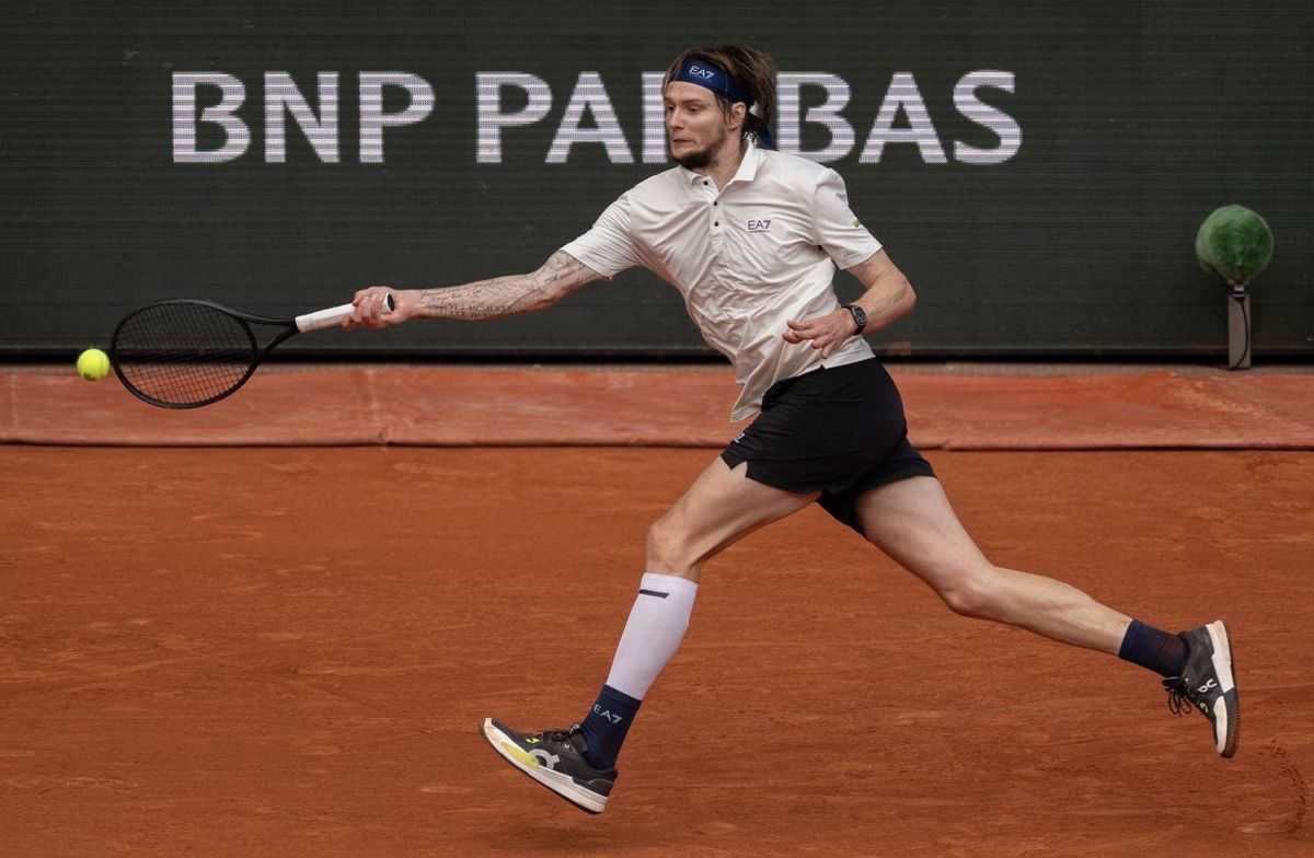 Jun 4, 2025; Paris, FR; Alexander Bublik of Kazakhstan returns a shot during his match against Jannik Sinner of Italy on day 11 at Roland Garros Stadium.  Mandatory Credit: Susan Mullane-Imagn Images