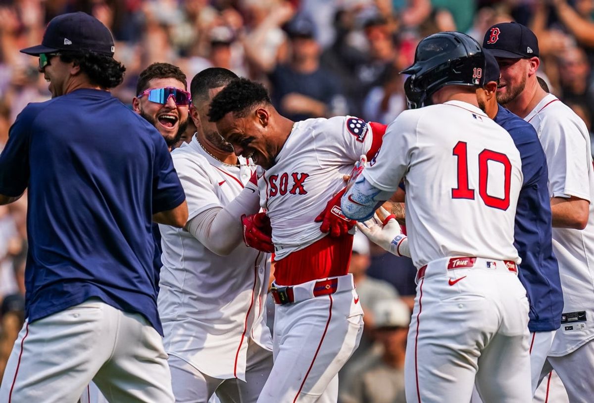 Jun 4, 2025; Boston, Massachusetts, USA; Boston Red Sox outfielder Ceddanne Rafaela (3) is congratulated after hitting a game winning home run against the Los Angeles Angels in the ninth inning at Fenway Park. Mandatory Credit: David Butler II-Imagn Images