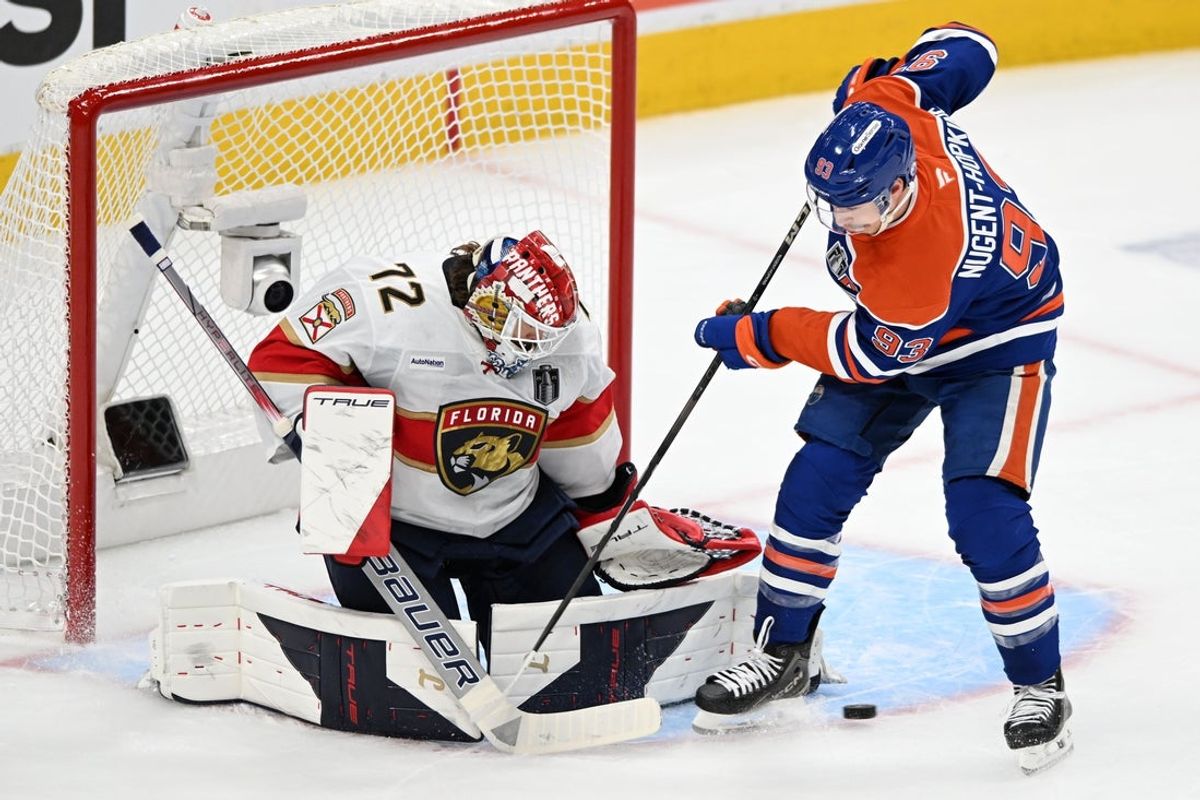 Jun 4, 2025; Edmonton, Alberta, CAN; Edmonton Oilers center Ryan Nugent-Hopkins (93) shoots the puck against Florida Panthers goaltender Sergei Bobrovsky (72) during the first period in game one of the 2025 Stanley Cup Final at Rogers Place. Mandatory Credit: Walter Tychnowicz-Imagn Images