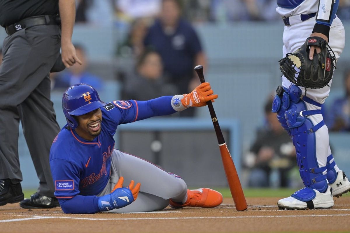 Jun 4, 2025; Los Angeles, California, USA; New York Mets shortstop Francisco Lindor (12) reacts to getting hit by a pitch first inning against the Los Angeles Dodgers at Dodger Stadium. Mandatory Credit: Jayne Kamin-Oncea-Imagn Images