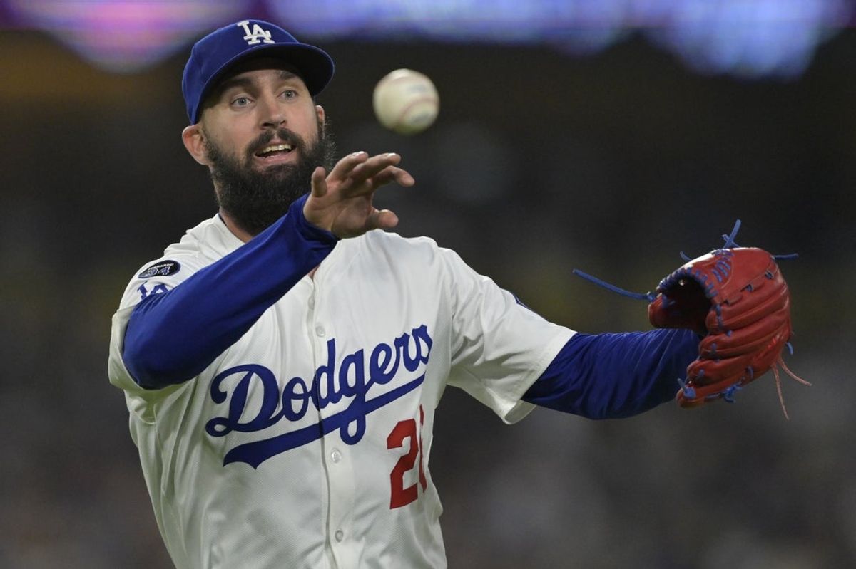 Jun 4, 2025; Los Angeles, California, USA;  Los Angeles Dodgers starting pitcher Tony Gonsolin (26) throws New York Mets catcher Luis Torrens (13) out at first in the fifth inning at Dodger Stadium. Mandatory Credit: Jayne Kamin-Oncea-Imagn Images