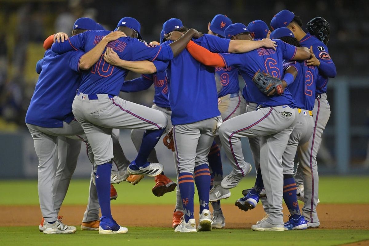 Jun 4, 2025; Los Angeles, California, USA; New York Mets players celebrate after the final out of the ninth inning against the Los Angeles Dodgers at Dodger Stadium. Mandatory Credit: Jayne Kamin-Oncea-Imagn Images
