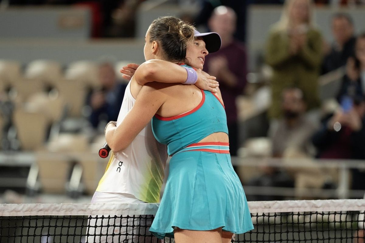 Jun 5, 2025; Paris, FR;  Aryna Sabalenka at the net with  Iga Swiatek of Poland  after their match on day 12 at Roland Garros Stadium. Mandatory Credit: Susan Mullane-Imagn Images
