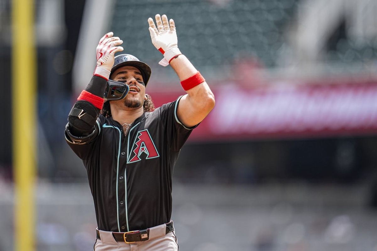 Jun 5, 2025; Cumberland, Georgia, USA; Arizona Diamondbacks center fielder Alek Thomas (5) reacts after hitting a home run against the Atlanta Braves during the ninth inning at Truist Park. Mandatory Credit: Dale Zanine-Imagn Images