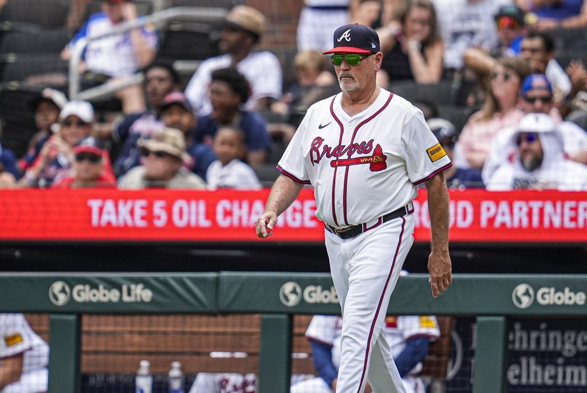 Jun 5, 2025; Cumberland, Georgia, USA; Atlanta Braves manager Brian Snitker (43) walks to the pitchers mound to change pitchers against the Arizona Diamondbacks during the ninth inning at Truist Park. Mandatory Credit: Dale Zanine-Imagn Images