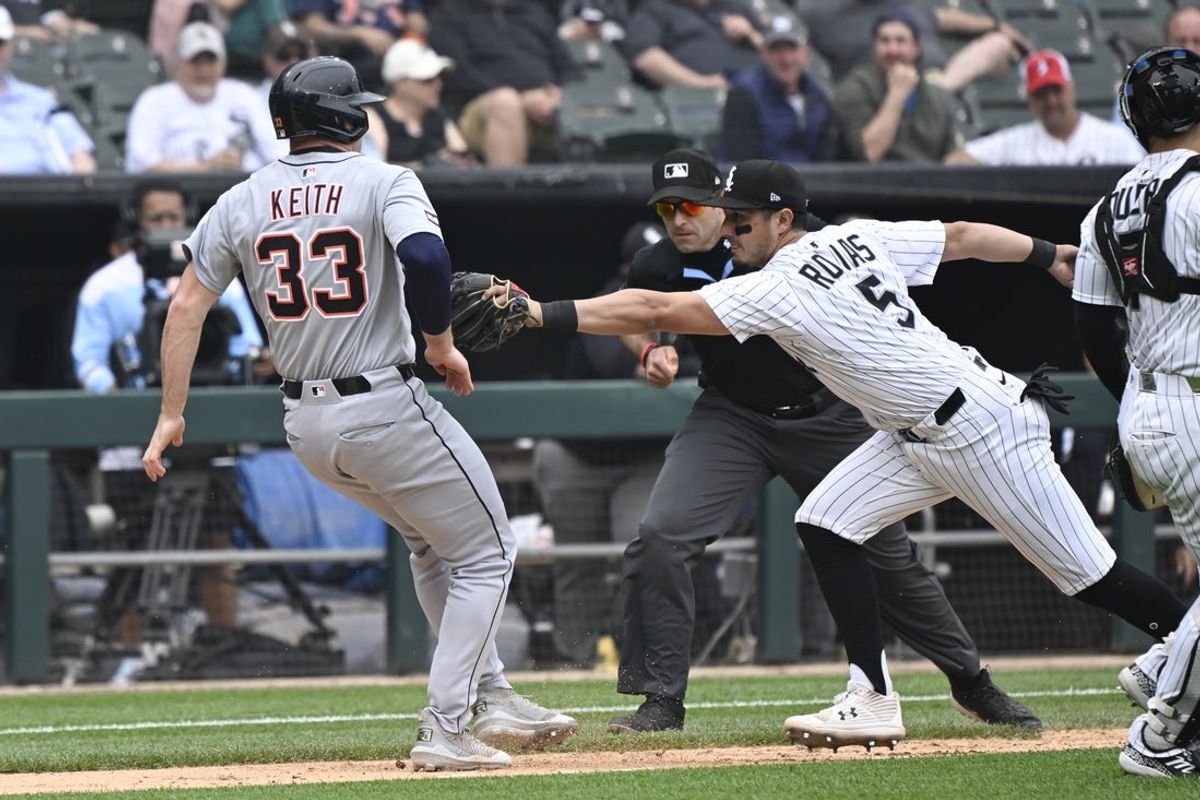 Jun 5, 2025; Chicago, Illinois, USA;  Chicago White Sox third base Josh Rojas (5) tries to tag Detroit Tigers second base Colt Keith (33) out during the seventh inning  at Rate Field. Mandatory Credit: Matt Marton-Imagn Images