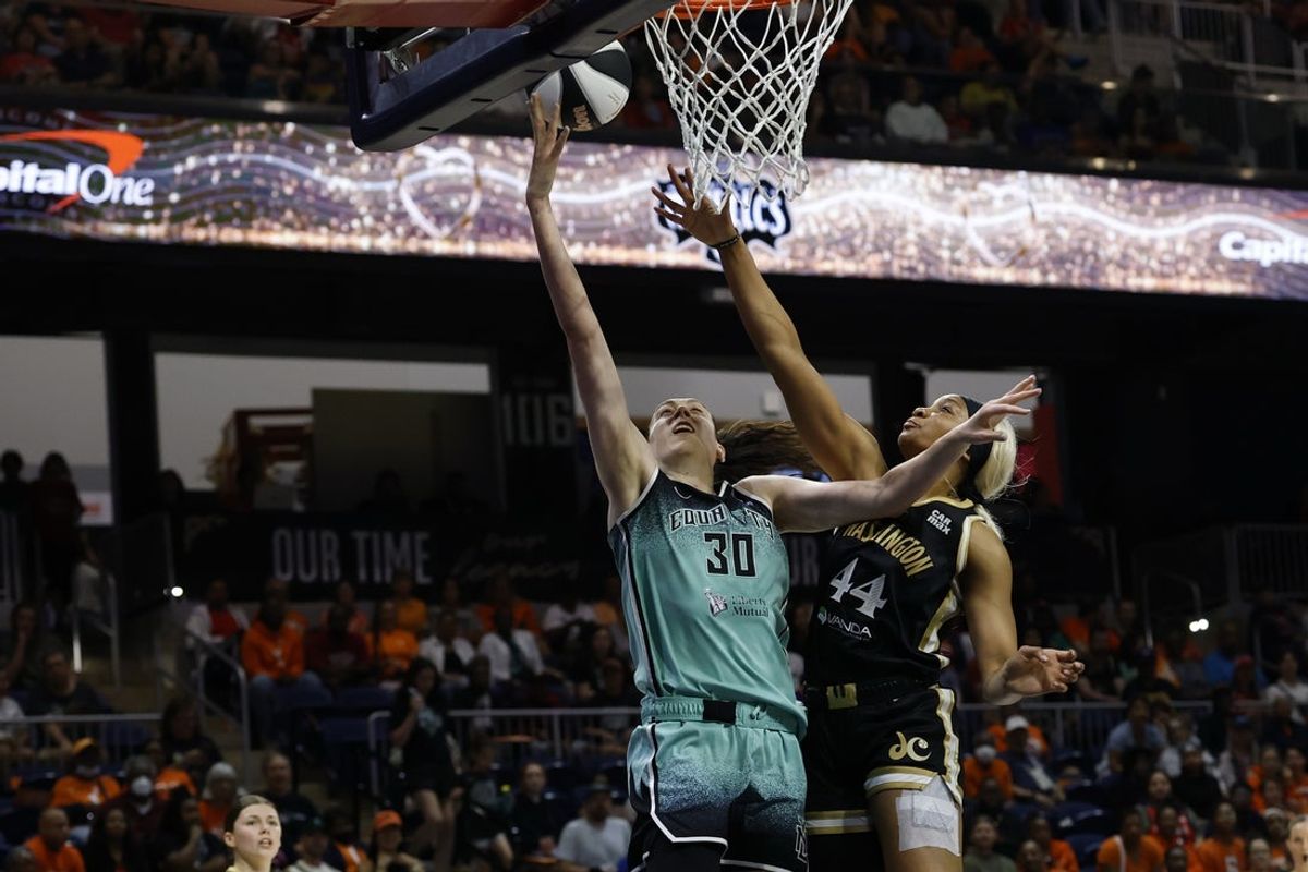 Jun 5, 2025; Washington, District of Columbia, USA; New York Liberty forward Breanna Stewart (30) shoots the ball while being fouled by Washington Mystics forward Kiki Iriafen (44) in the first half at Entertainment & Sports Arena. Mandatory Credit: Geoff Burke-Imagn Images