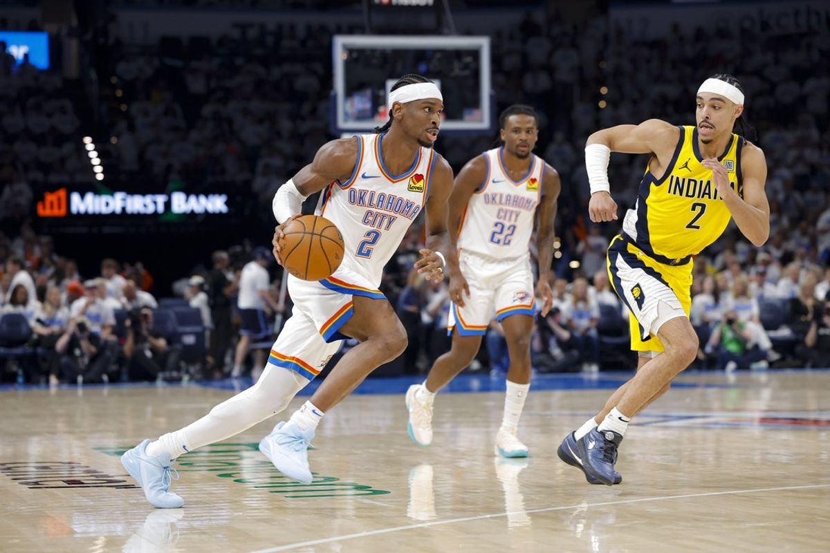 Jun 5, 2025; Oklahoma City, Oklahoma, USA; Oklahoma City Thunder guard Shai Gilgeous-Alexander (2) drives to the basket past Indiana Pacers guard Andrew Nembhard (2) during the third quarter during game one of the 2025 NBA Finals at Paycom Center. Mandatory Credit: Alonzo Adams-Imagn Images