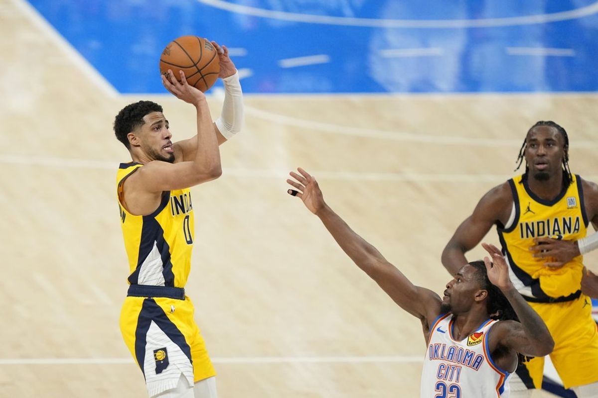Jun 5, 2025; Oklahoma City, Oklahoma, USA; Indiana Pacers guard Tyrese Haliburton (0) shoots the ball against Oklahoma City Thunder guard Cason Wallace (22) during the fourth quarter in game one of the 2025 NBA Finals at Paycom Center. Mandatory Credit: Kyle Terada-Imagn Images