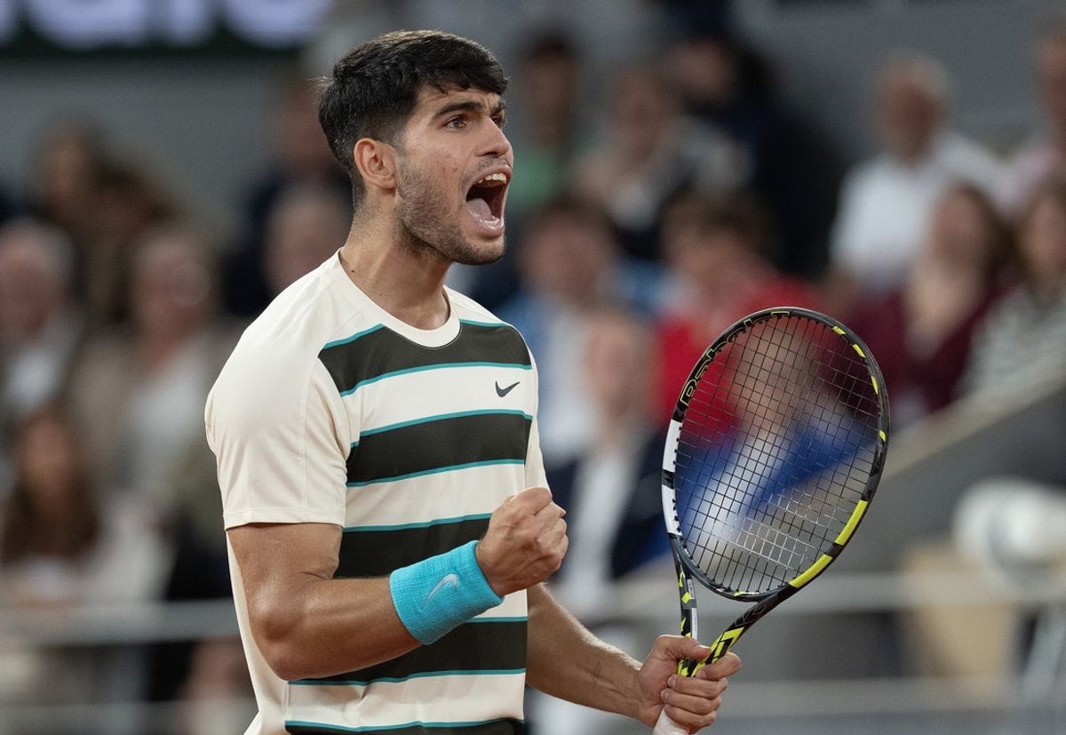 Jun 6, 2025; Paris, FR;  Carlos Alcaraz of Spain reacts to a point during his match against Lorenzo Musetti of Italy match on day 13 at Roland Garros Stadium. Mandatory Credit: Susan Mullane-Imagn Images