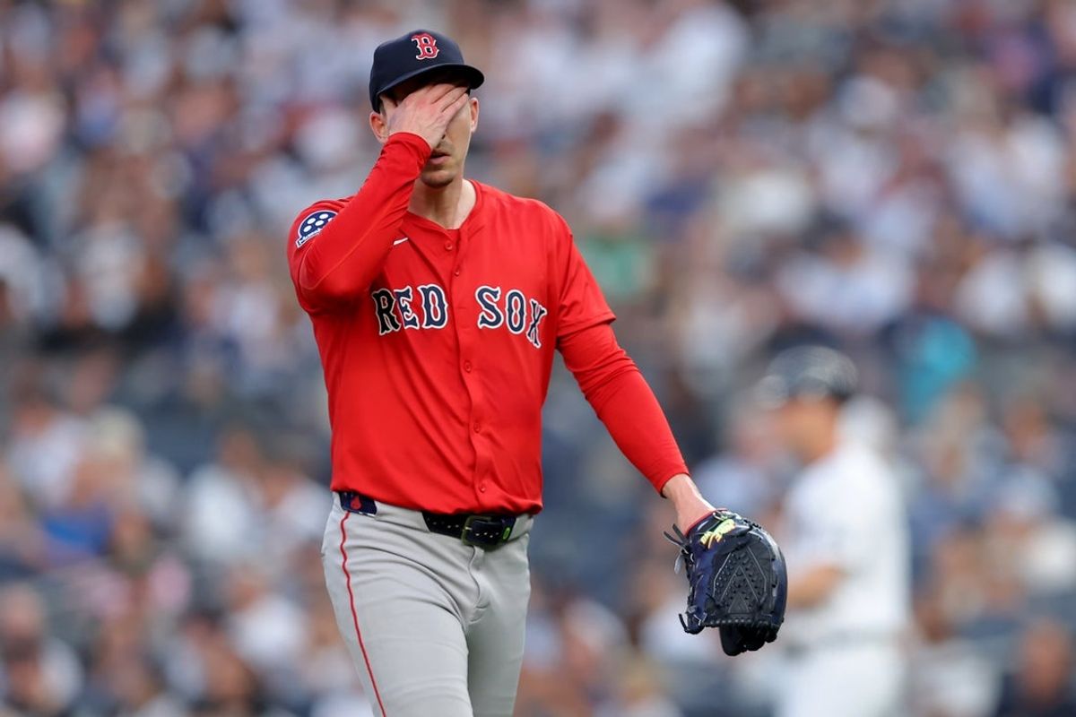 Jun 6, 2025; Bronx, New York, USA; Boston Red Sox starting pitcher Walker Buehler (0) reacts after the first inning against the New York Yankees at Yankee Stadium. Mandatory Credit: Brad Penner-Imagn Images