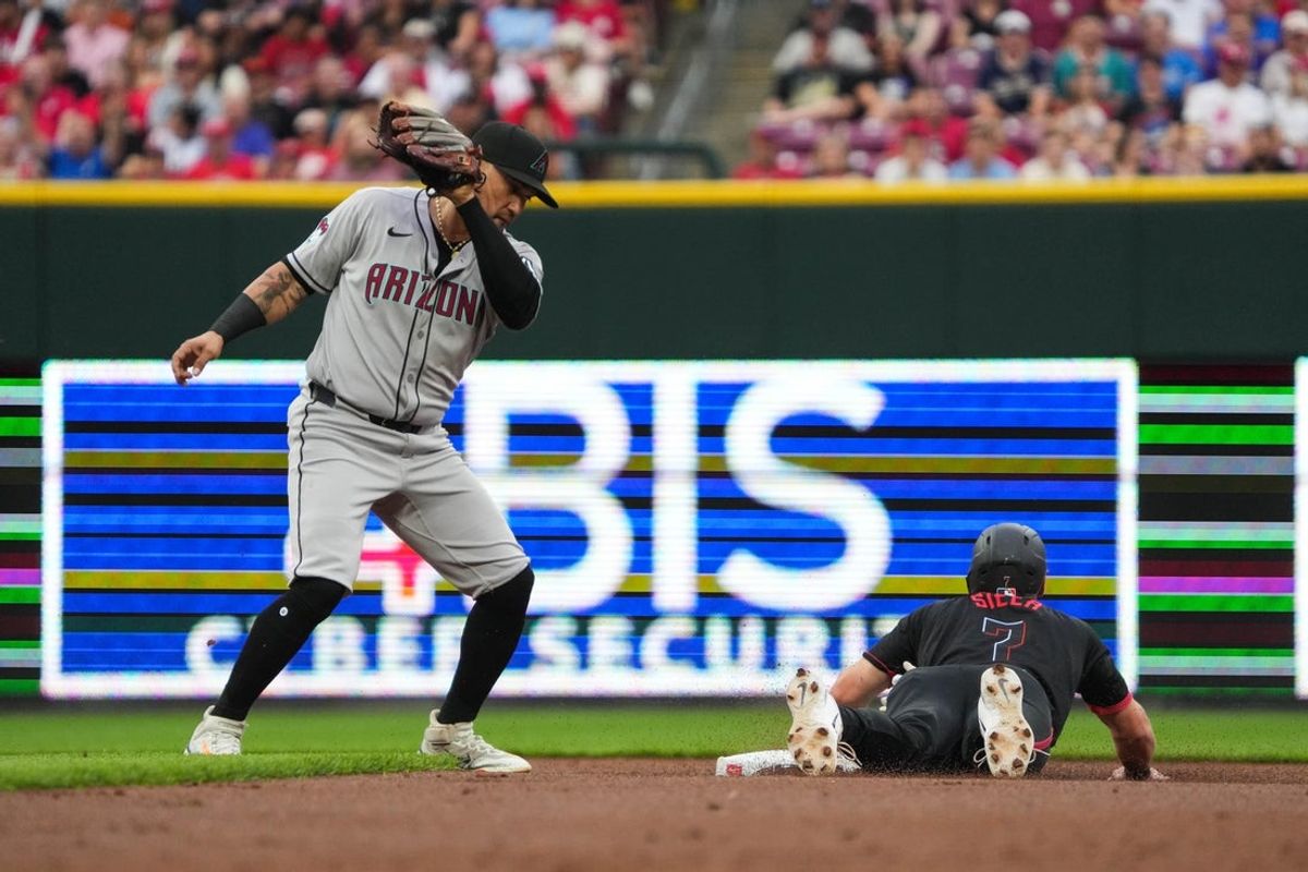 Reds Spencer Steer (7) is safe at second base during their game against the Diamondbacks at Great American Ball Park on Friday June 6, 2025.