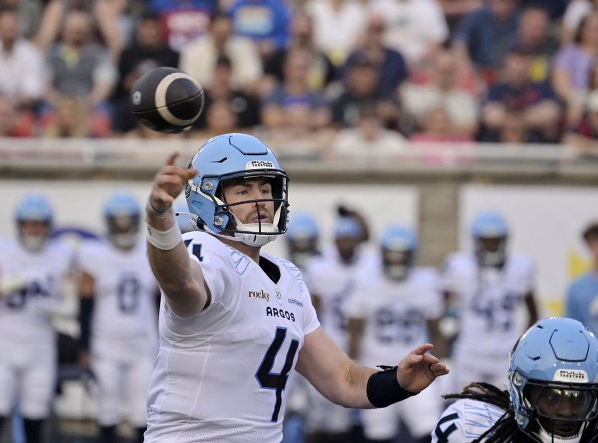 Jun 6, 2025; Montreal, Quebec, Canada; Toronto Argonauts quarterback  Nick Arbuckle (4) throws a pass during the first half against the Montreal Alouettes at Percival-Molson stadium. Mandatory Credit: Eric Bolte-Imagn Images