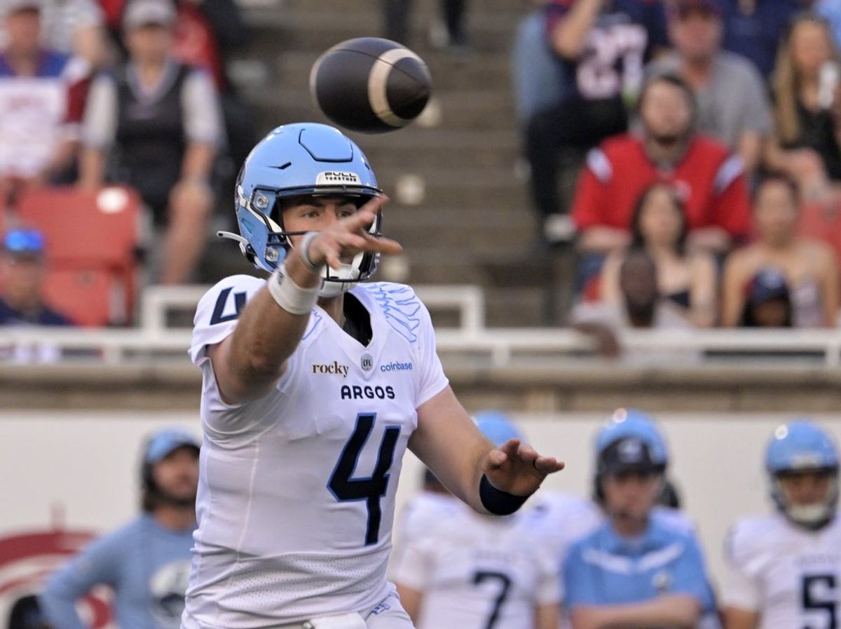 Jun 6, 2025; Montreal, Quebec, Canada; Toronto Argonauts quarterback  Nick Arbuckle (4) throws a pass during the first half against the Montreal Alouettes at Percival-Molson stadium. Mandatory Credit: Eric Bolte-Imagn Images