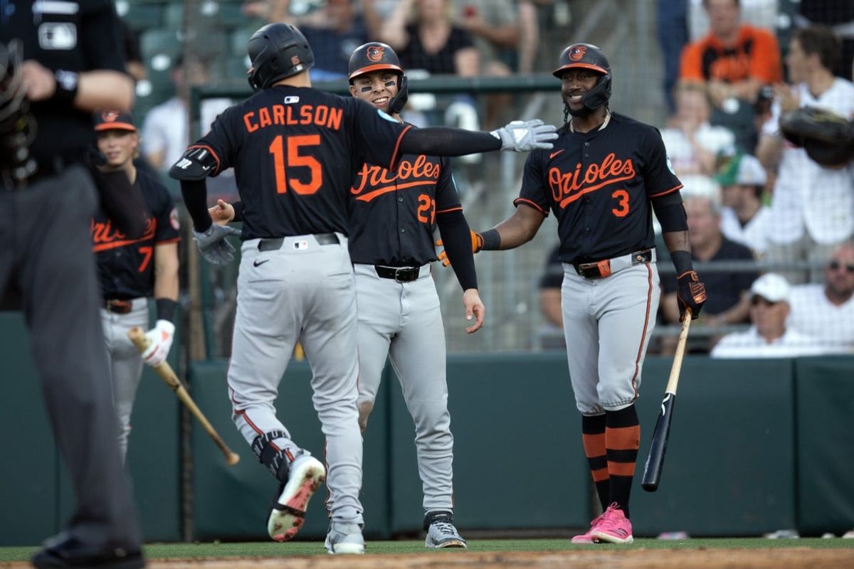 Jun 6, 2025; West Sacramento, California, USA; Baltimore Orioles left fielder Dylan Carlson (15) is greeted by teammates Ramón Urías (29) and Jorge Mateo (3) after hitting a two-run home run against the Athletics during the second inning at Sutter Health Park. Mandatory Credit: D. Ross Cameron-Imagn Images