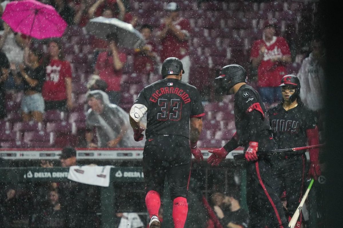 Jun 6, 2025; Cincinnati, OH, USA; Reds Christian Encarnacion-Strand (33) scores a homerun during their game against the Diamondbacks at Great American Ball Park on Friday June 6, 2025. Mandatory Credit: Phil Didion-USA TODAY Network via Imagn Images
