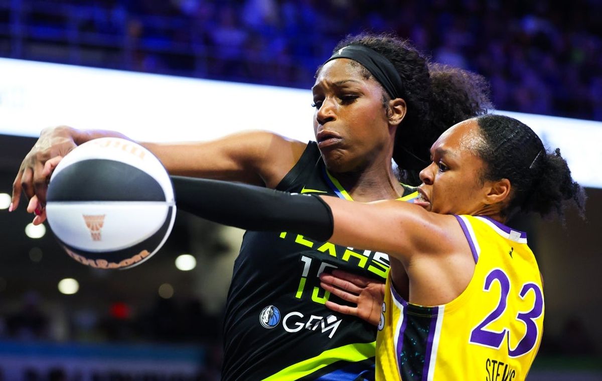 Jun 6, 2025; Arlington, Texas, USA;  Los Angeles Sparks forward Azura Stevens (23) and Dallas Wings center Teaira McCowan (15) go for the ball during the second half at College Park Center. Mandatory Credit: Kevin Jairaj-Imagn Images