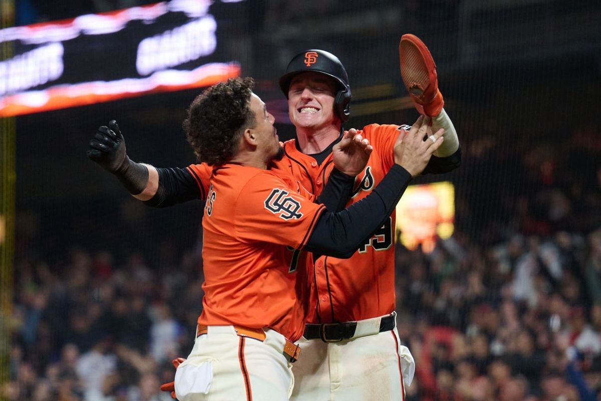Jun 6, 2025; San Francisco, California, USA; San Francisco Giants shortstop Willy Adames (2) and second baseman Tyler Fitzgerald (49) leap and celebrate the walk-off winning run against the Atlanta Braves during the tenth inning at Oracle Park. Mandatory Credit: Robert Edwards-Imagn Images