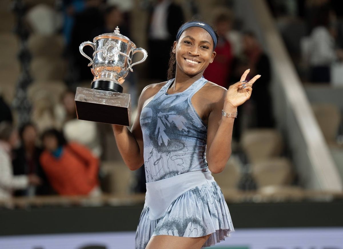 Jun 7, 2025; Paris, FR;  Coco Gauff of the United States poses with the trophy after winning the women’s singles final against Aryna Sabalenka on day 14 at Roland Garros Stadium. Mandatory Credit: Susan Mullane-Imagn Images
