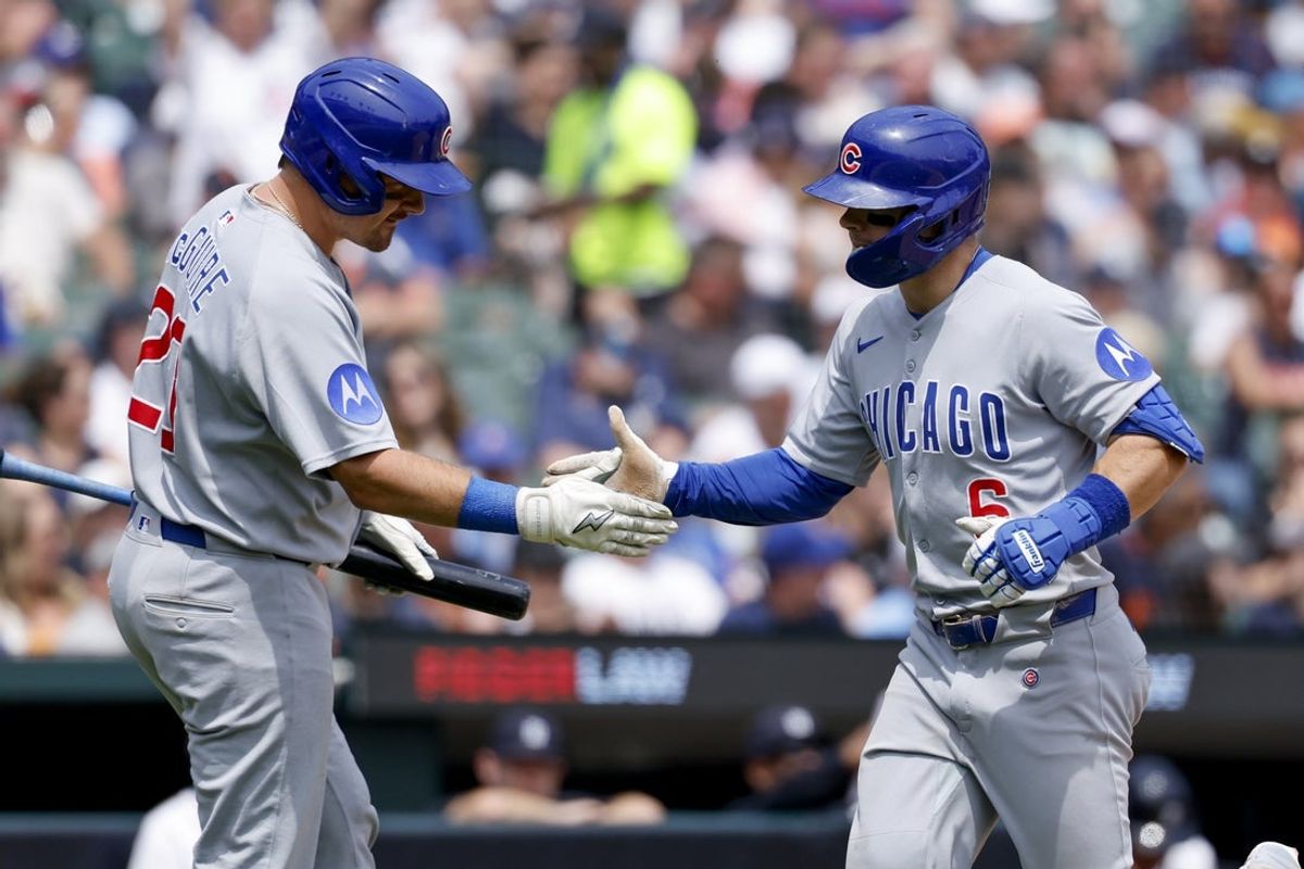 Jun 7, 2025; Detroit, Michigan, USA;  Chicago Cubs third baseman Matt Shaw (6) receives congratulations from catcher Reese McGuire (20)  after he hits a home run in the seventh inning against the Detroit Tigers at Comerica Park. Mandatory Credit: Rick Osentoski-Imagn Images