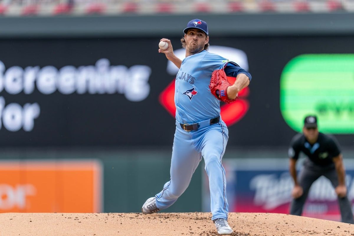 Jun 7, 2025; Minneapolis, Minnesota, USA; Toronto Blue Jays starting pitcher Kevin Gausman (34) pitches to Minnesota Twins shortstop Carlos Correa (4) in the first inning at Target Field. Mandatory Credit: Matt Blewett-Imagn Images
