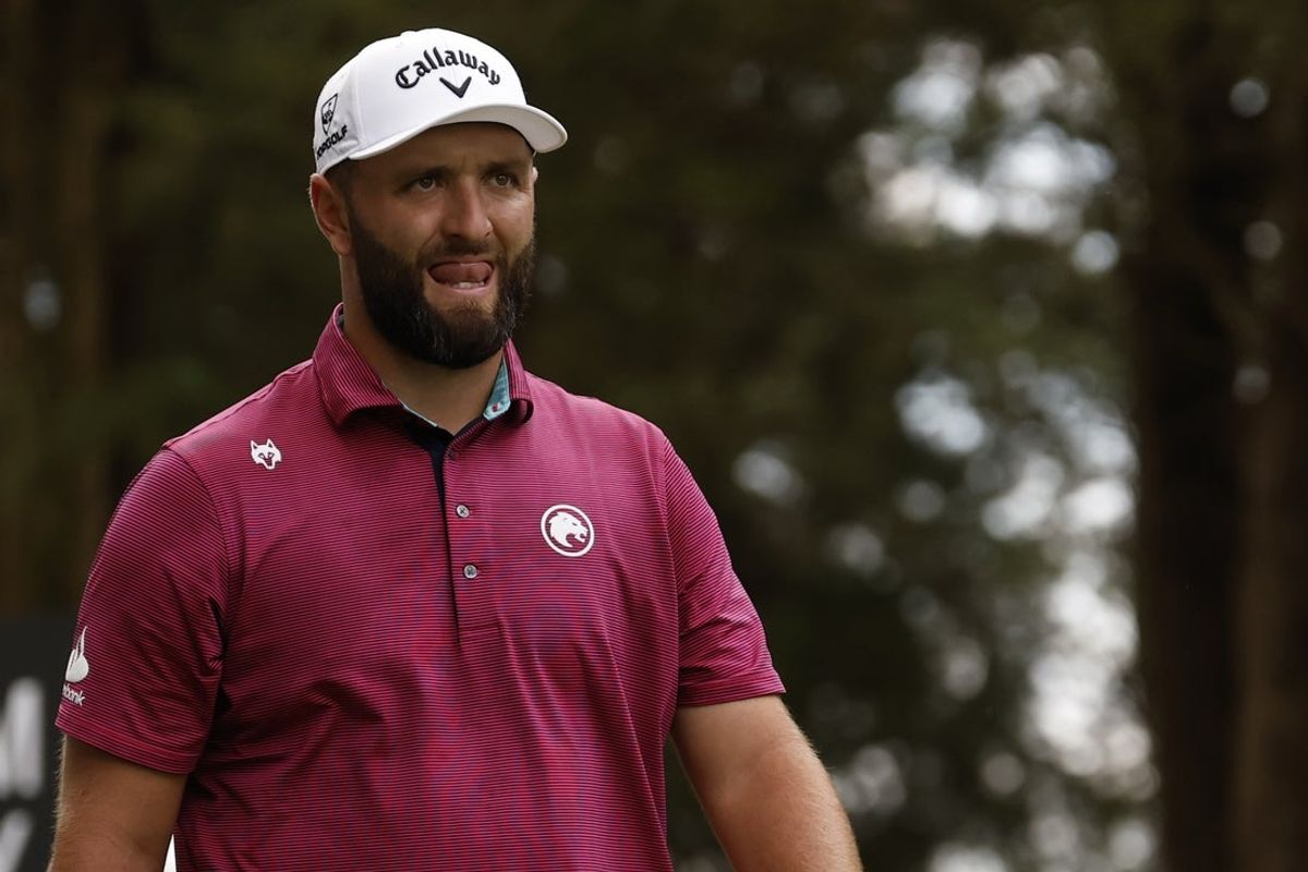 Jun 7, 2025; Gainesville, Virginia, USA; Jon Rahm of team Legion XIII reacts while walking off the second tee during the second round of the LIV Golf Virginia golf tournament at Robert Trent Jones Golf Club. Mandatory Credit: Geoff Burke-Imagn Images