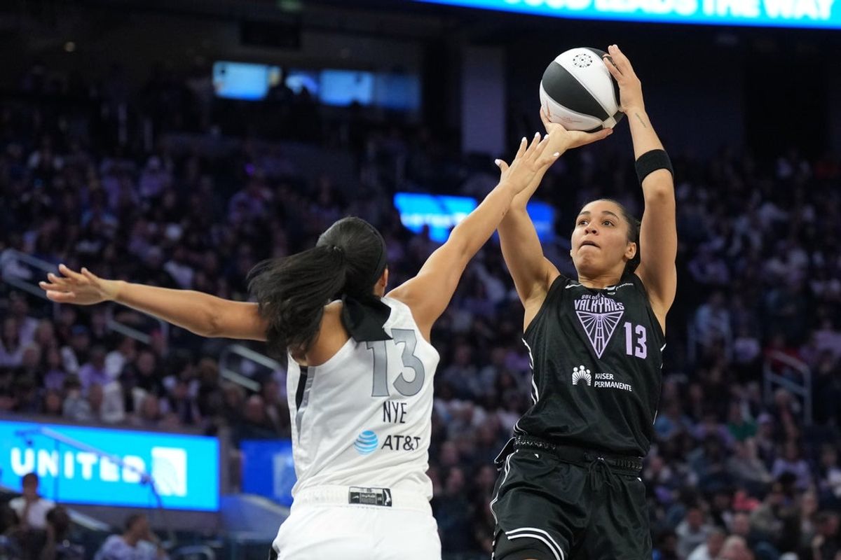 Jun 7, 2025; San Francisco, California, USA; Golden State Valkyries forward Janelle Salaun (right) shoots against Las Vegas Aces guard Aaliyah Nye (left) during the second quarter at Chase Center. Mandatory Credit: Darren Yamashita-Imagn Images