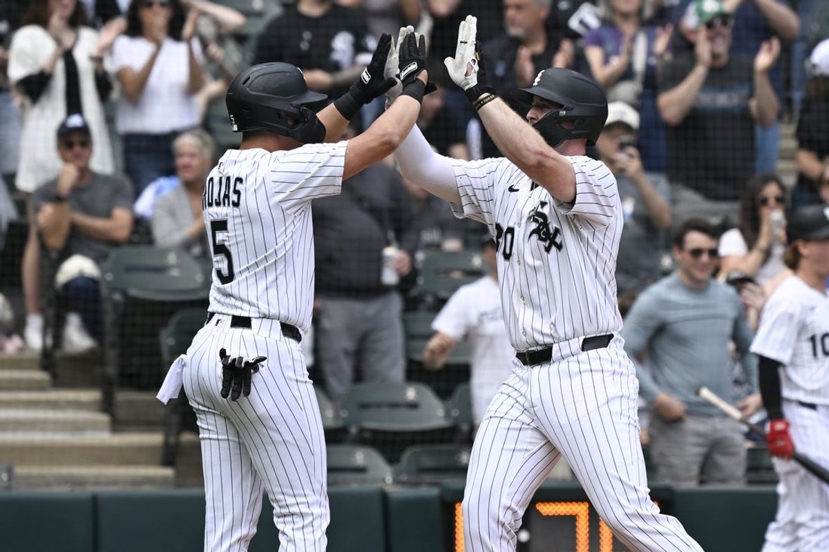 Jun 7, 2025; Chicago, Illinois, USA;  Chicago White Sox first baseman Tim Elko (30) high fives second baseman Josh Rojas (5) after they score on Elko’s two run home run during the second inning against the Kansas City Royals at Rate Field. Mandatory Credit: Matt Marton-Imagn Images