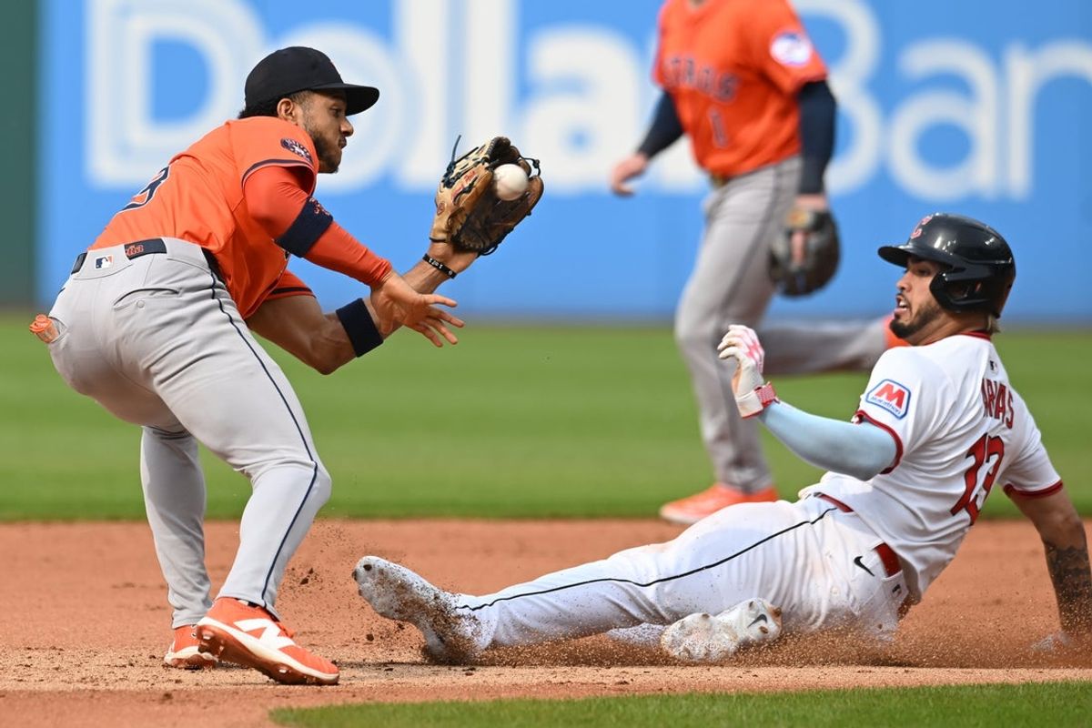 Jun 7, 2025; Cleveland, Ohio, USA; Cleveland Guardians shortstop Gabriel Arias (13) is caught stealing by Houston Astros shortstop Jeremy Pena (3) during the fourth inning at Progressive Field. Mandatory Credit: Ken Blaze-Imagn Images