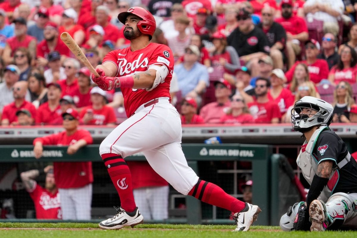 Cincinnati Reds third baseman Christian Encarnacion-Strand (33) follows through on a three-run home run in the first inning of the MLB National League game between the Cincinnati Reds and the Arizona Diamondbacks at Great American Ball Park in downtown Cincinnati on Saturday, June 7, 2025.