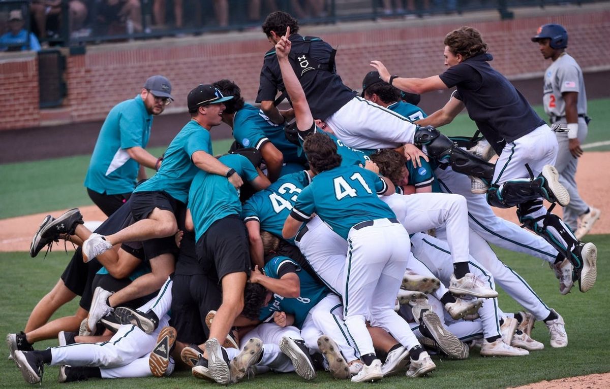 Coastal Carolina players dogpile after eliminating Auburn in the NCAA Baseball Super Regonal at Plainsman Park in Auburn, Ala., on Friday June 6, 2025.