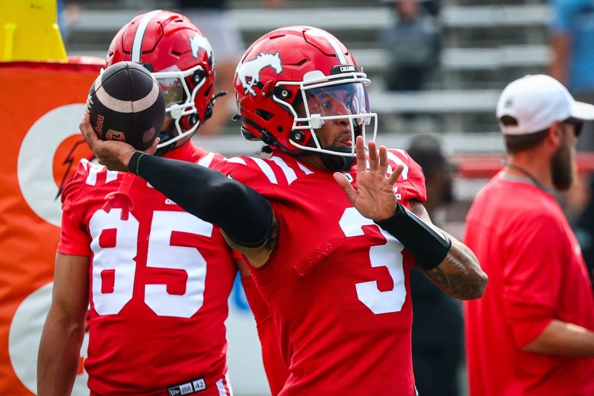 Jun 7, 2025; Calgary, Alberta, Canada; Calgary Stampeders quarterback Vernon Adams Jr (3) throws the ball during warmup against the Hamilton Tiger-Cats at McMahon Stadium. Mandatory Credit: Sergei Belski-Imagn Images