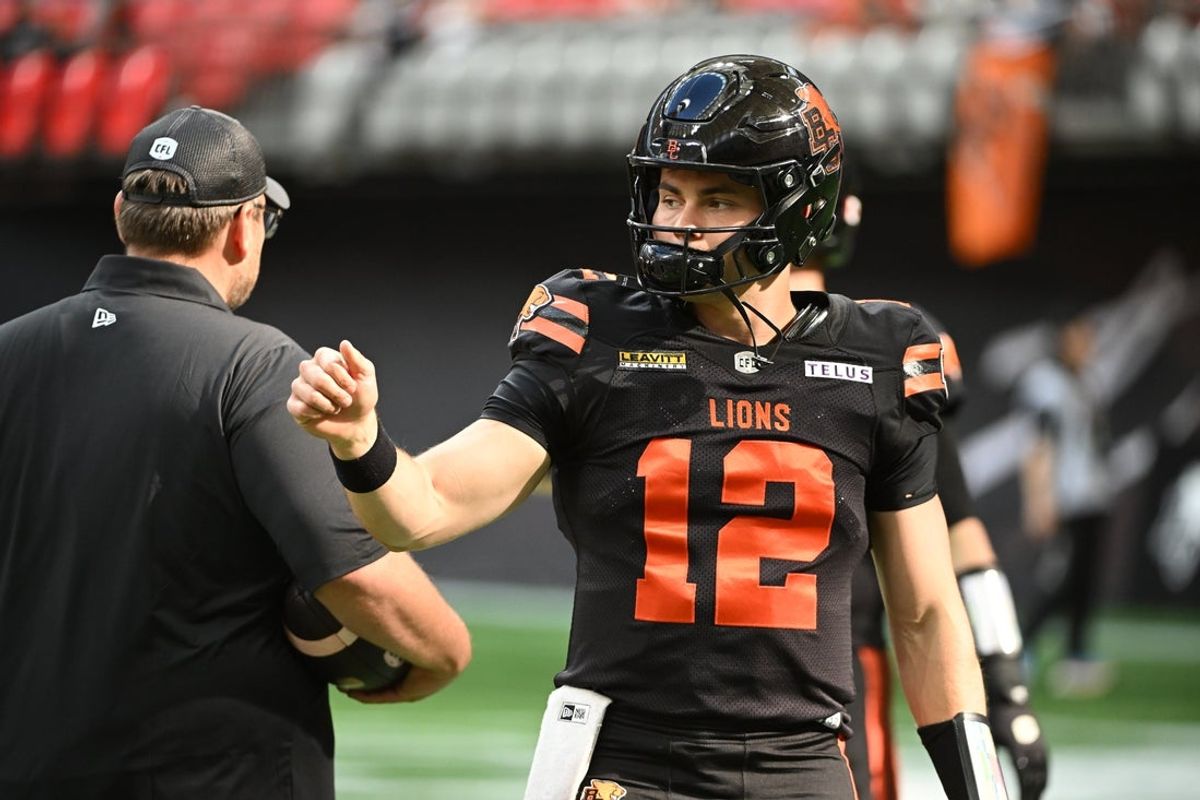 Jun 7, 2025; Vancouver, British Columbia, Canada;  BC Lions quarterback Nathan Rourke (12) warms up prior to the game against the Edmonton Elks at BC Place Stadium. Mandatory Credit: Anne-Marie Sorvin-Imagn Images