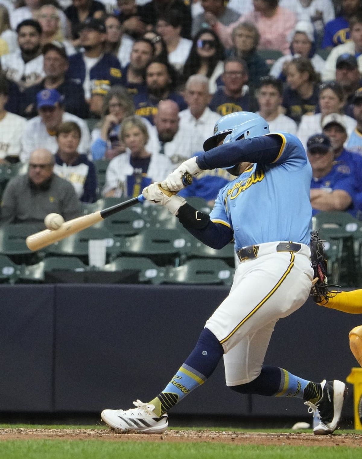 Jun 7, 2025; Milwaukee, Wisconsin, USA; Milwaukee Brewers third base Caleb Durbin (21) hits to San Diego Padres third base Manny Machado (13) for an out in the fifth inning at American Family Field. Mandatory Credit: Michael McLoone-Imagn Images