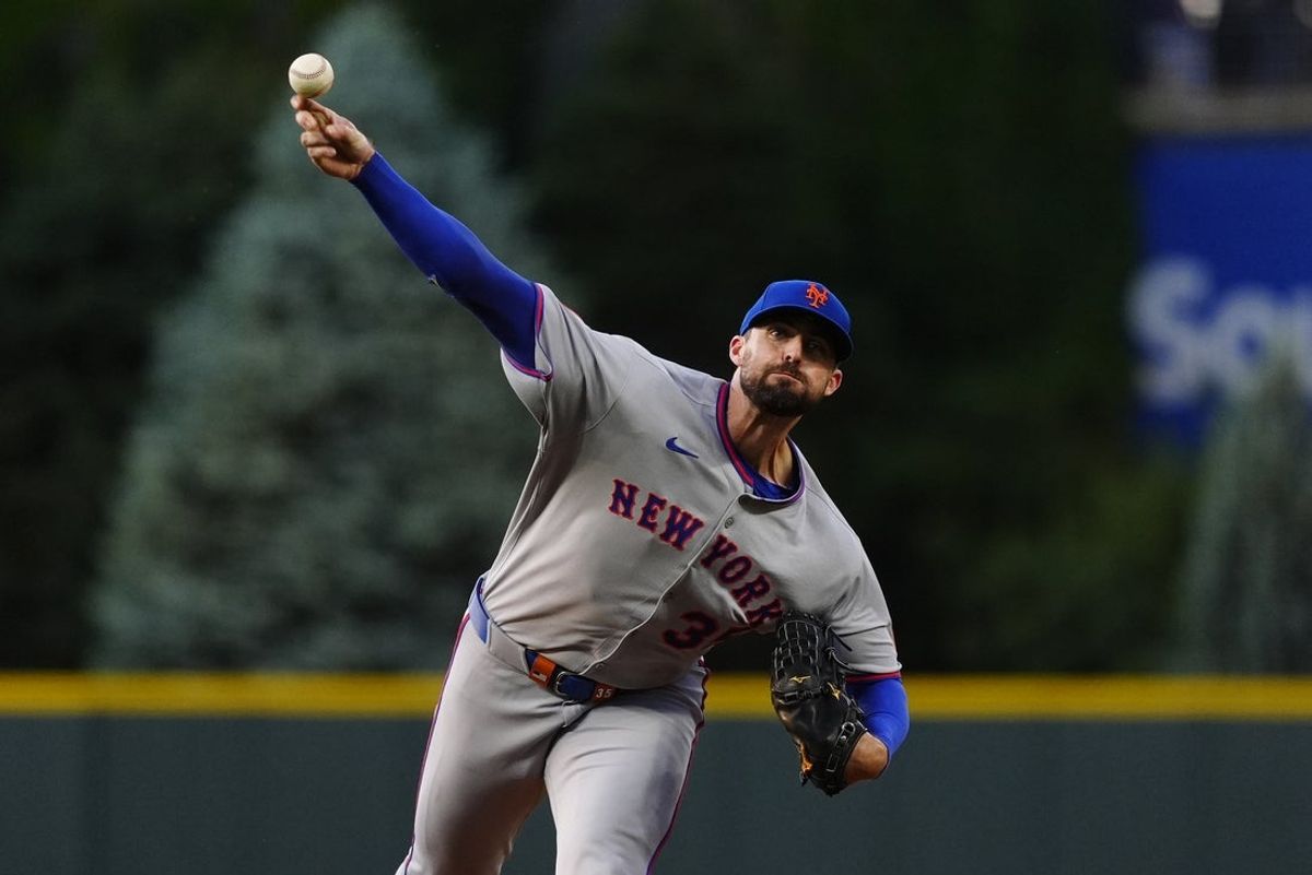 Jun 7, 2025; Denver, Colorado, USA; New York Mets starting pitcher Clay Holmes (35) delivers a pitch in the first inning against the New York Mets at Coors Field. Mandatory Credit: Ron Chenoy-Imagn Images
