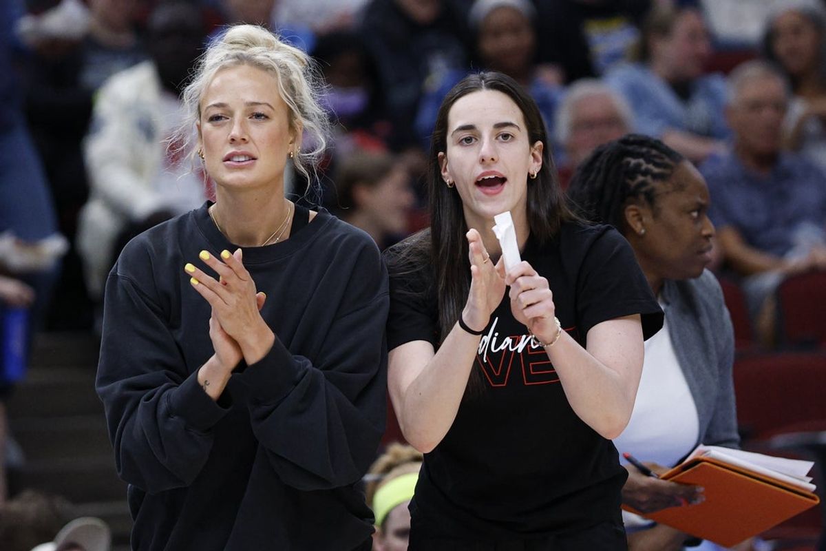 Jun 7, 2025; Chicago, Illinois, USA; Injured Indiana Fever guard Sophie Cunningham (8) and guard Caitlin Clark (22) react from the bench during the first half of a WNBA game against the Chicago Sky at United Center. Mandatory Credit: Kamil Krzaczynski-Imagn Images