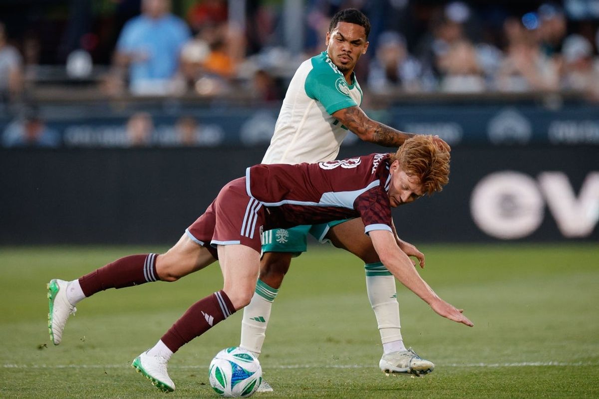 Jun 7, 2025; Commerce City, Colorado, USA; Colorado Rapids midfielder Oliver Larraz (8) gets tied up with Austin FC midfielder Daniel Pereira (8) in the first half at Dick's Sporting Goods Park. Mandatory Credit: Isaiah J. Downing-Imagn Images
